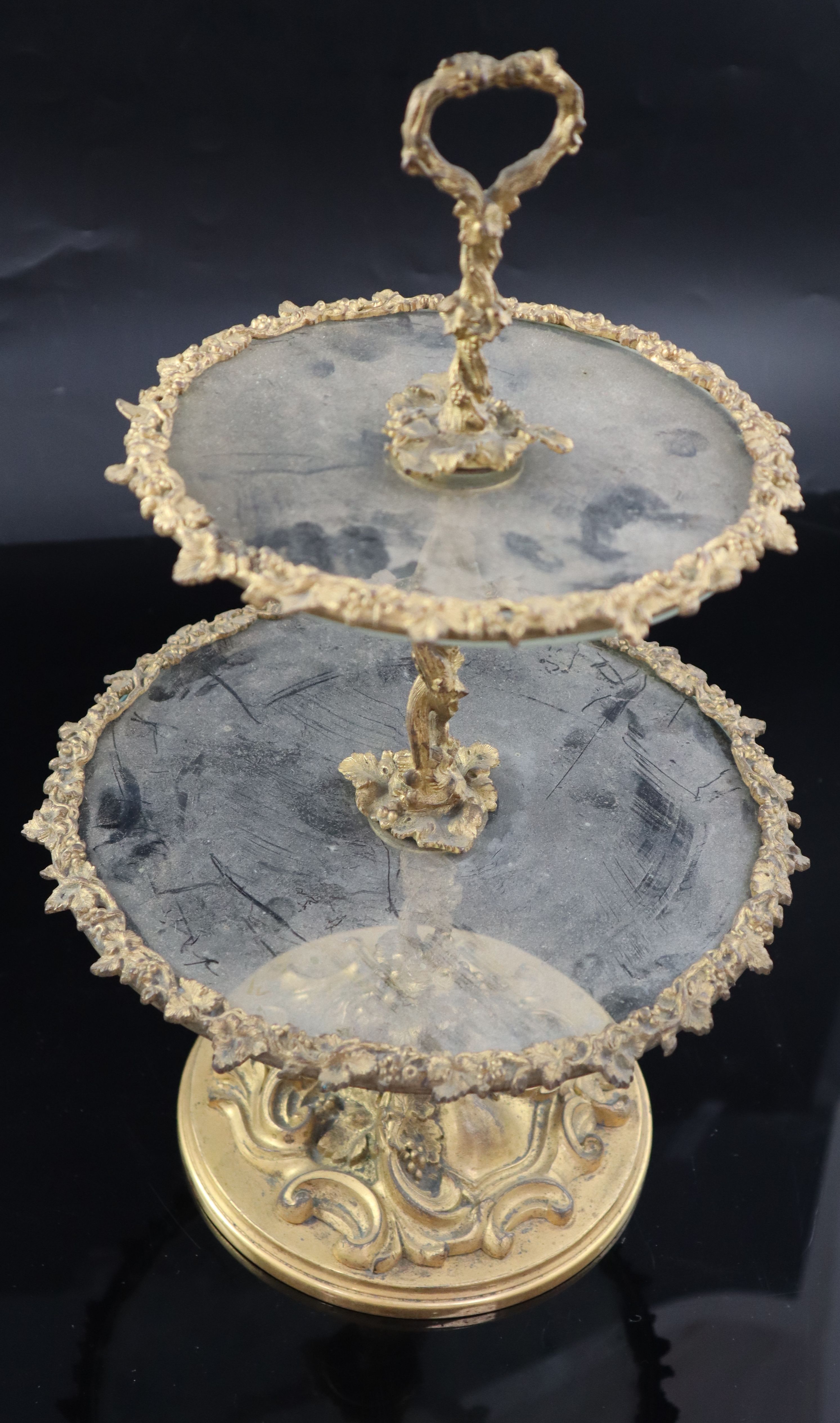 A Victorian ormolu and glass two tier cake stand, height 38cm diameter 24cm